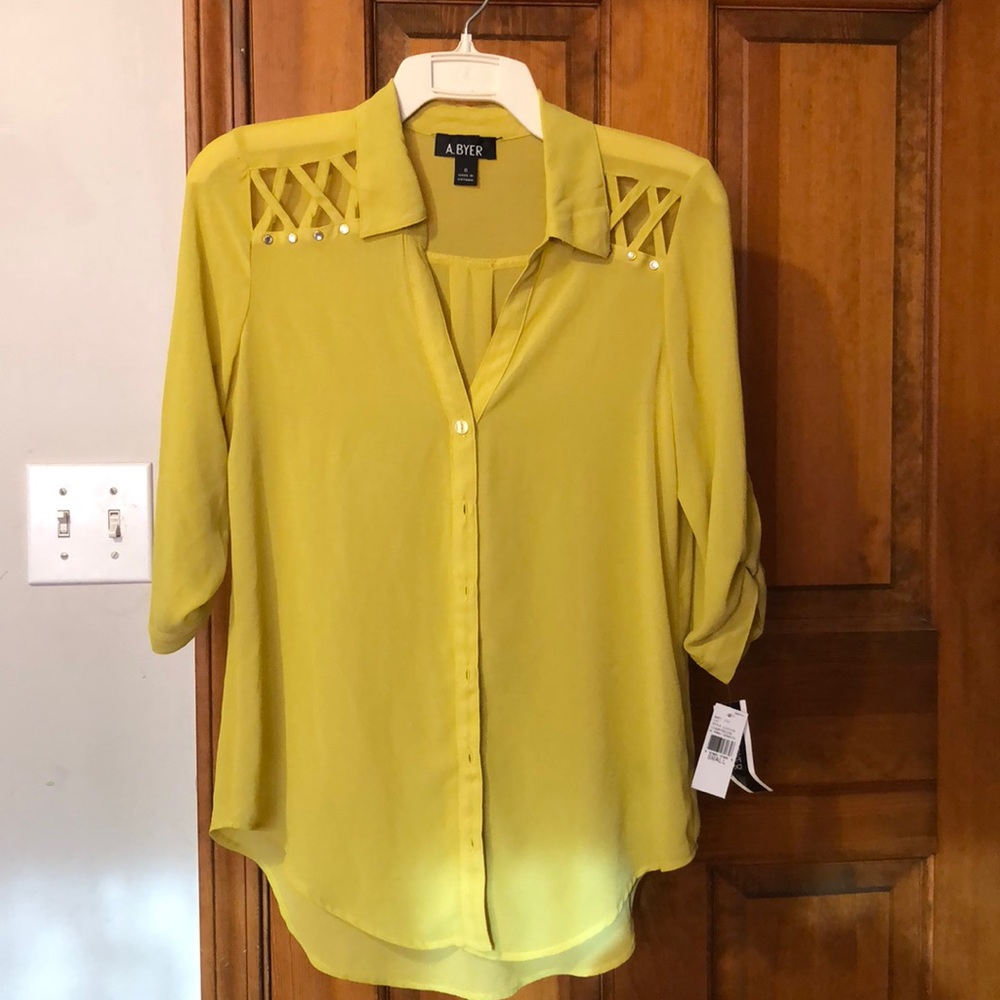 Chartreuse A. Buyer blouse with shoulder detail.